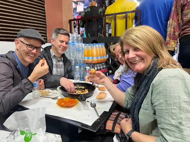 Guests sharing makla bel kefta with bread