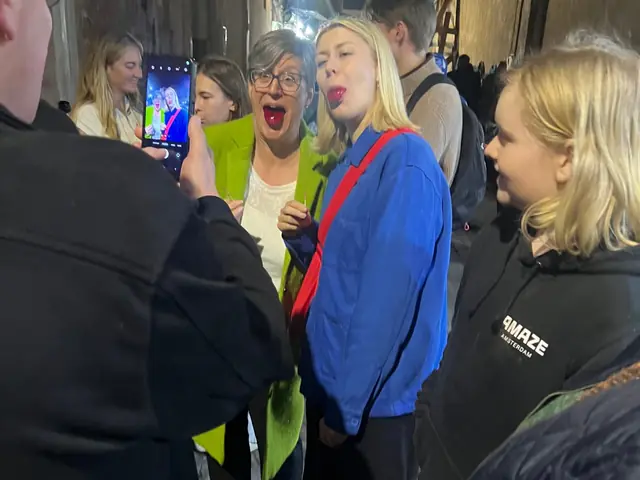 Guests laughing together at a stop on the tour